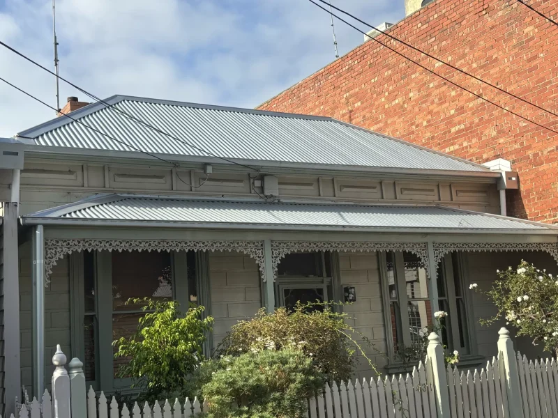 Front view of a house on Dorcas Street with a newly restored galvanised roof and a terrace.